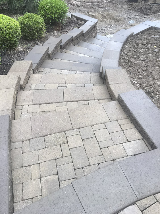 Driveway installation with stone pavers by OmniPro Pittsburgh